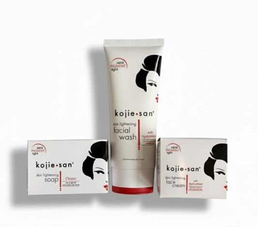 Kojie San skincare products including soap, facial wash, and face cream on a white background